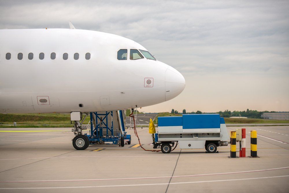 Parked airplane being refilled