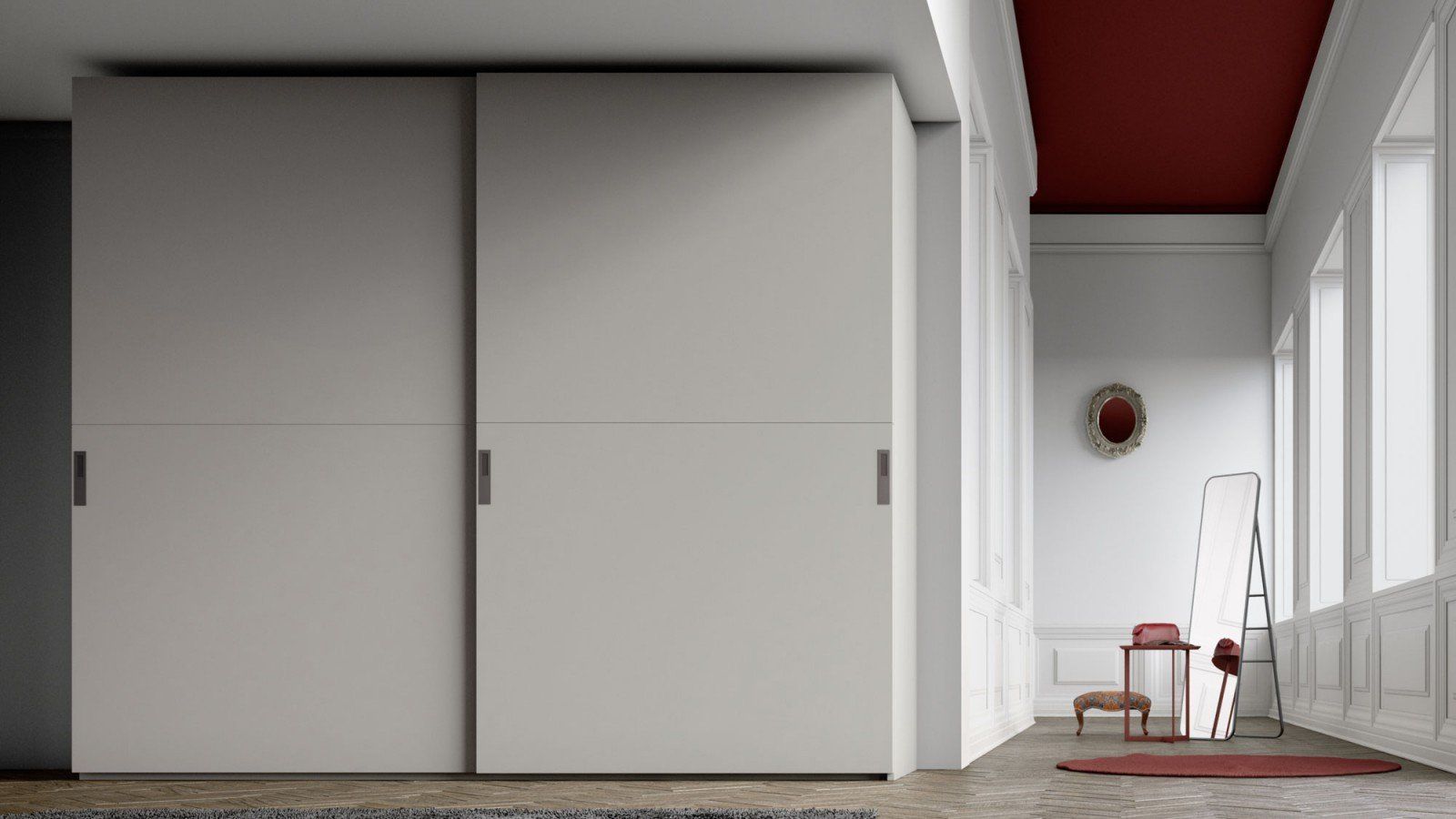 Corridoio minimalista bianco con ampi armadi, soffitto rosso, una sedia, una scala e un piccolo tappeto.
