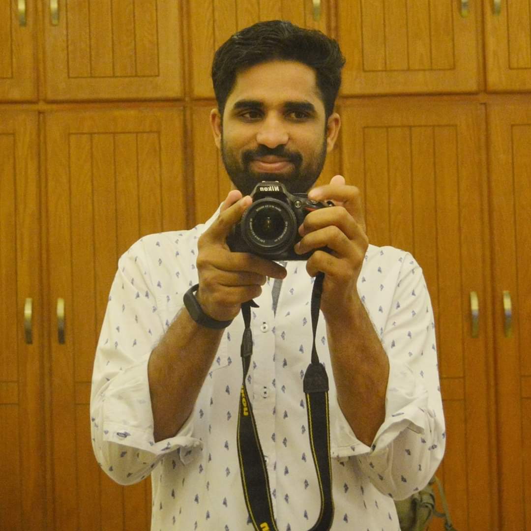 A man is taking a picture of himself with a camera