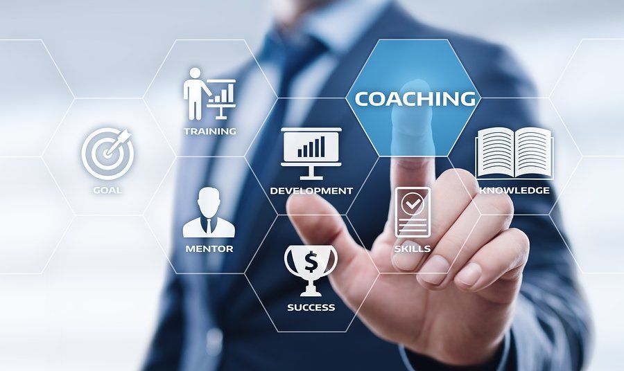 A man is pressing a button on a screen that says coaching.