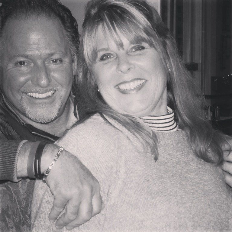 A black and white photo of a man and woman smiling