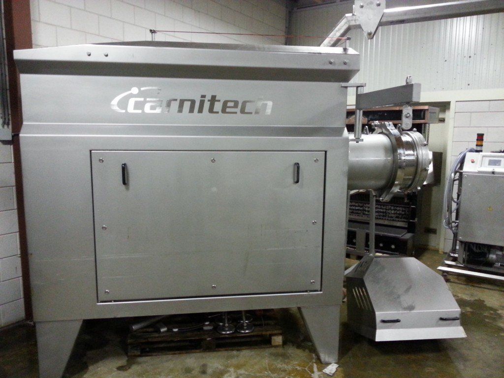 Large stainless steel industrial machine labeled 