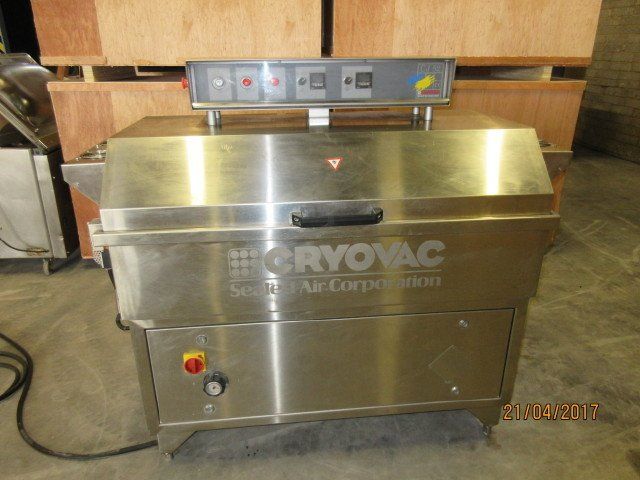 Stainless steel industrial vacuum sealer with control panel. 