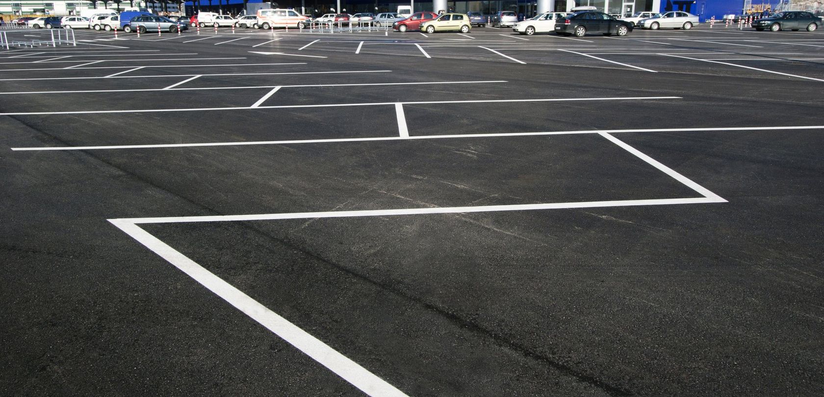 Commercial Paving Services — Empty Parking Lot Day Time in Dallas, TX Commercial Paving Services — Empty Parking Lot Day Time in Dallas, TX