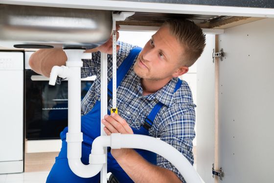 Plumbing Services — Plumber Fixing White Sink Pipe in Roxboro, NC Plumbing Services — Plumber Fixing White Sink Pipe in Roxboro, NC