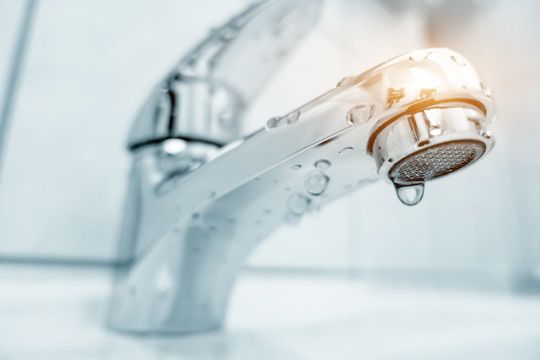 Water Heater Parts — Shower Head with Drops of Water Falling Down in Roxboro, NC Water Heater Parts — Shower Head with Drops of Water Falling Down in Roxboro, NC