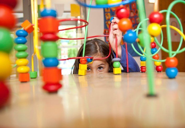 Young girl playing with an educational toy