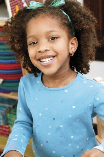 Girl in blue smiling