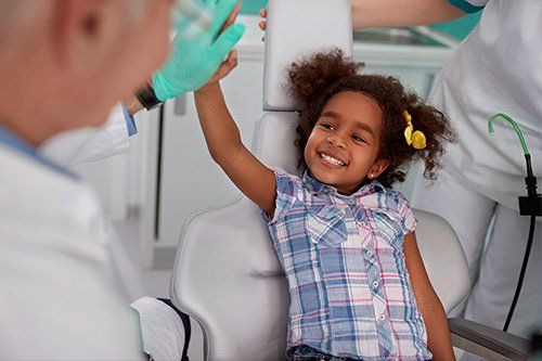 female child after teeth cleaning