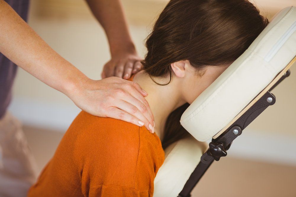 Young Woman Getting Massage In Chair — VR Mobile Beauty Therapy In Oxenford QLD