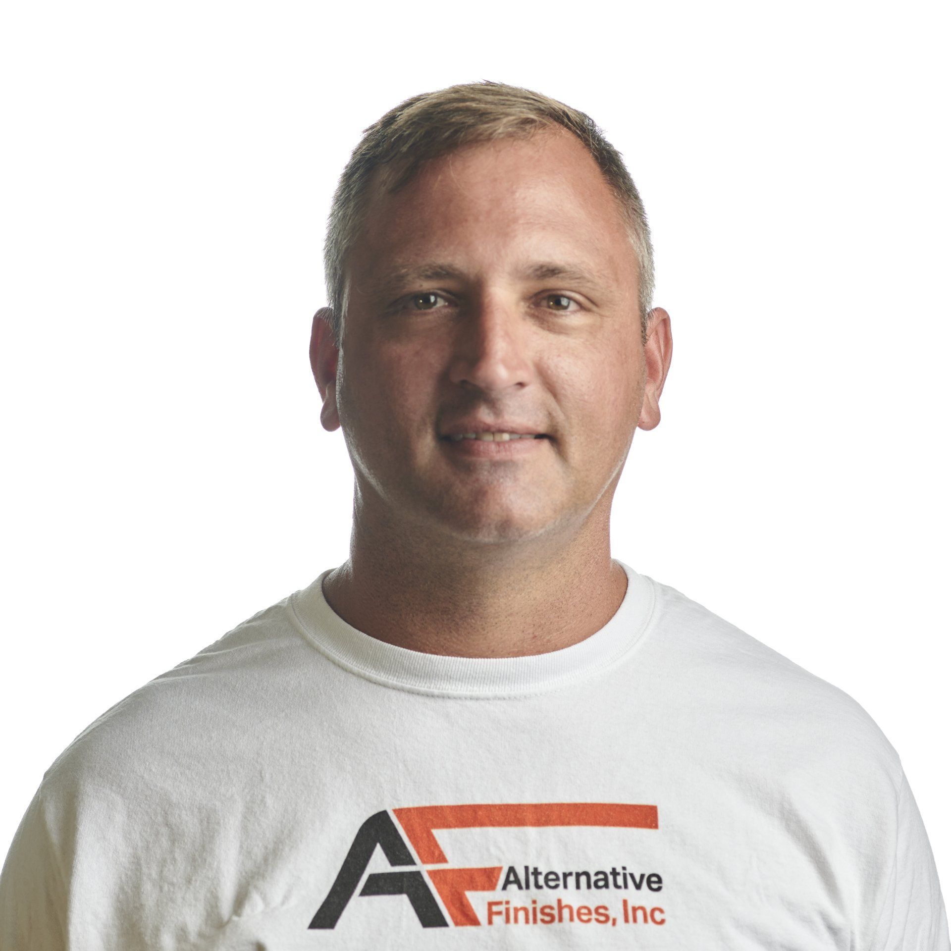 Man in white shirt with Alternative Finishes, Inc. logo smiles at camera.