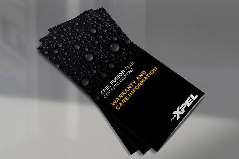Brochures for XPEL Fusion Plus ceramic coating. Black background with text 