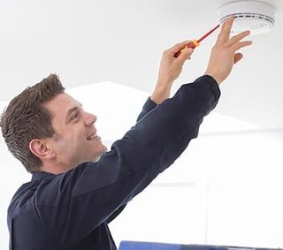 Installation of a Smoke Detector — Fire Alarm Repair in Saint Louis, MO Installation of a Smoke Detector — Fire Alarm Repair in Saint Louis, MO
