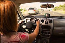 Driving Female — Automotive Repairs In Grand Junction, CO Driving Female — Automotive Repairs In Grand Junction, CO