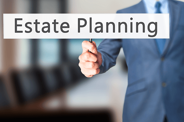 Man Holding Estate Planning Tag — Medina County, OH — Laribee & Hertrick, LLP Man Holding Estate Planning Tag — Medina County, OH — Laribee & Hertrick, LLP