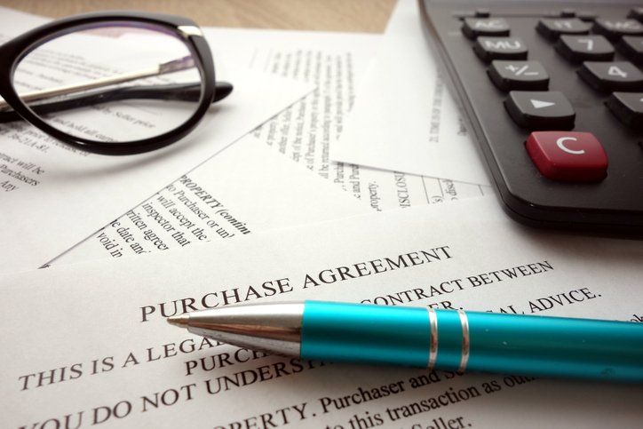 Glass, Pen, and Calculator — Medina County, OH — Laribee & Hertrick, LLP