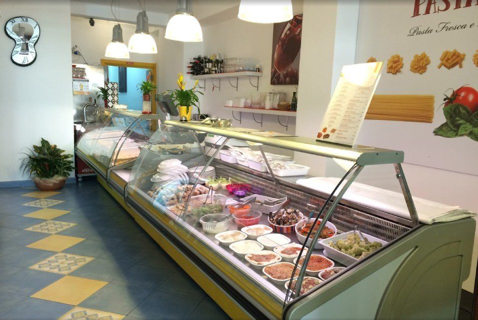 Glass counter with artisanal pasta and fresh sauces