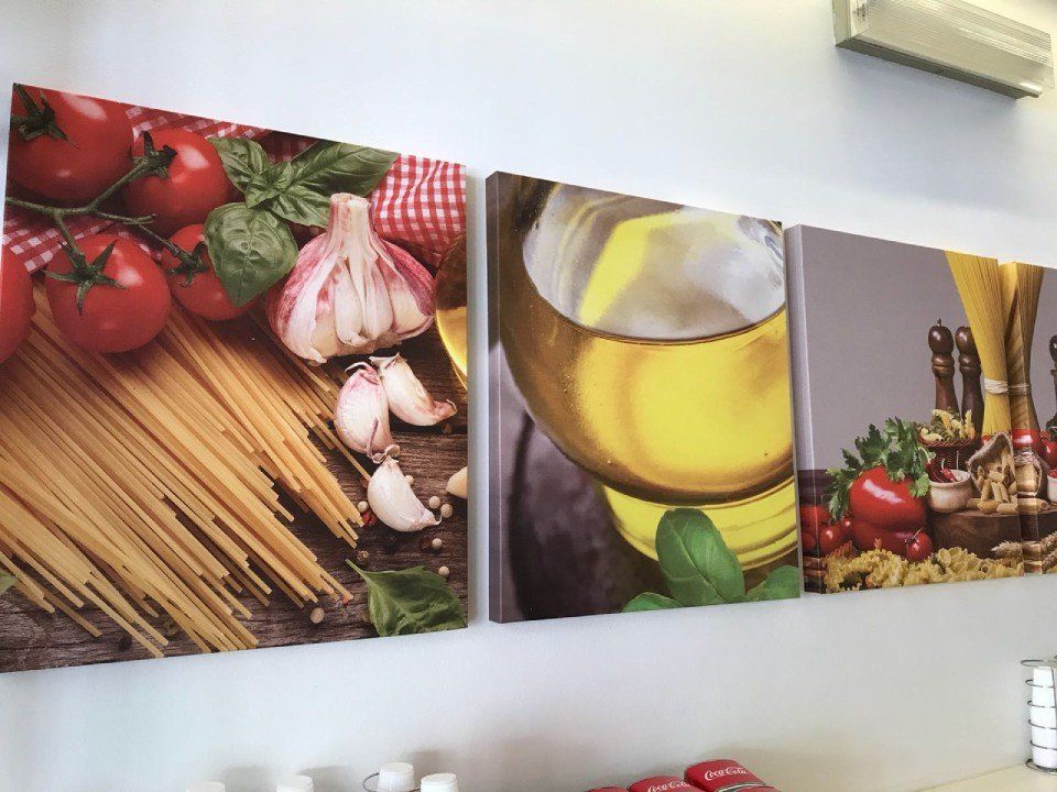 Interior of the Pasta & Pasti restaurant with paintings
