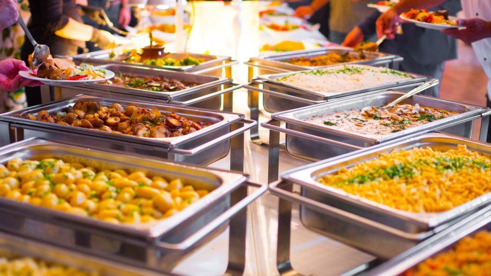 Table with buffet of first and second courses at an event