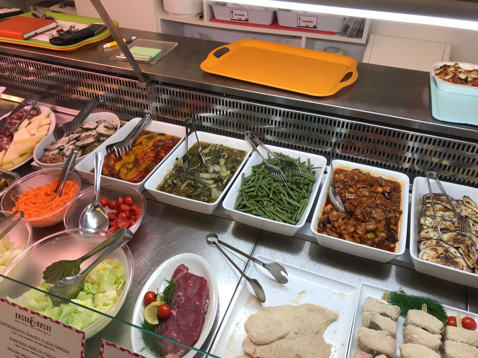Glass counter with a wide selection of side dishes and sauces