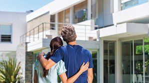 A Young Couple Outside Their House — Hopewell, VA — A-1 Insurance Agency