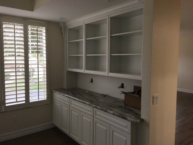 renovation remodel cabinets and built-in shelving with countertop