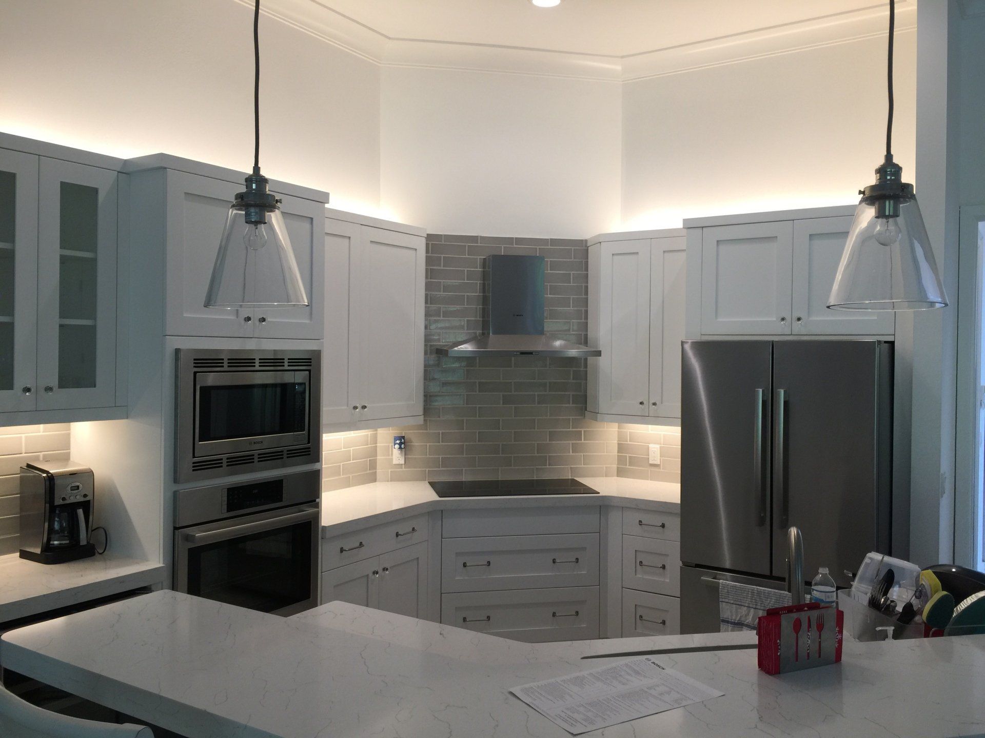 luxury kitchen remodel renovation white design with island and backsplash
