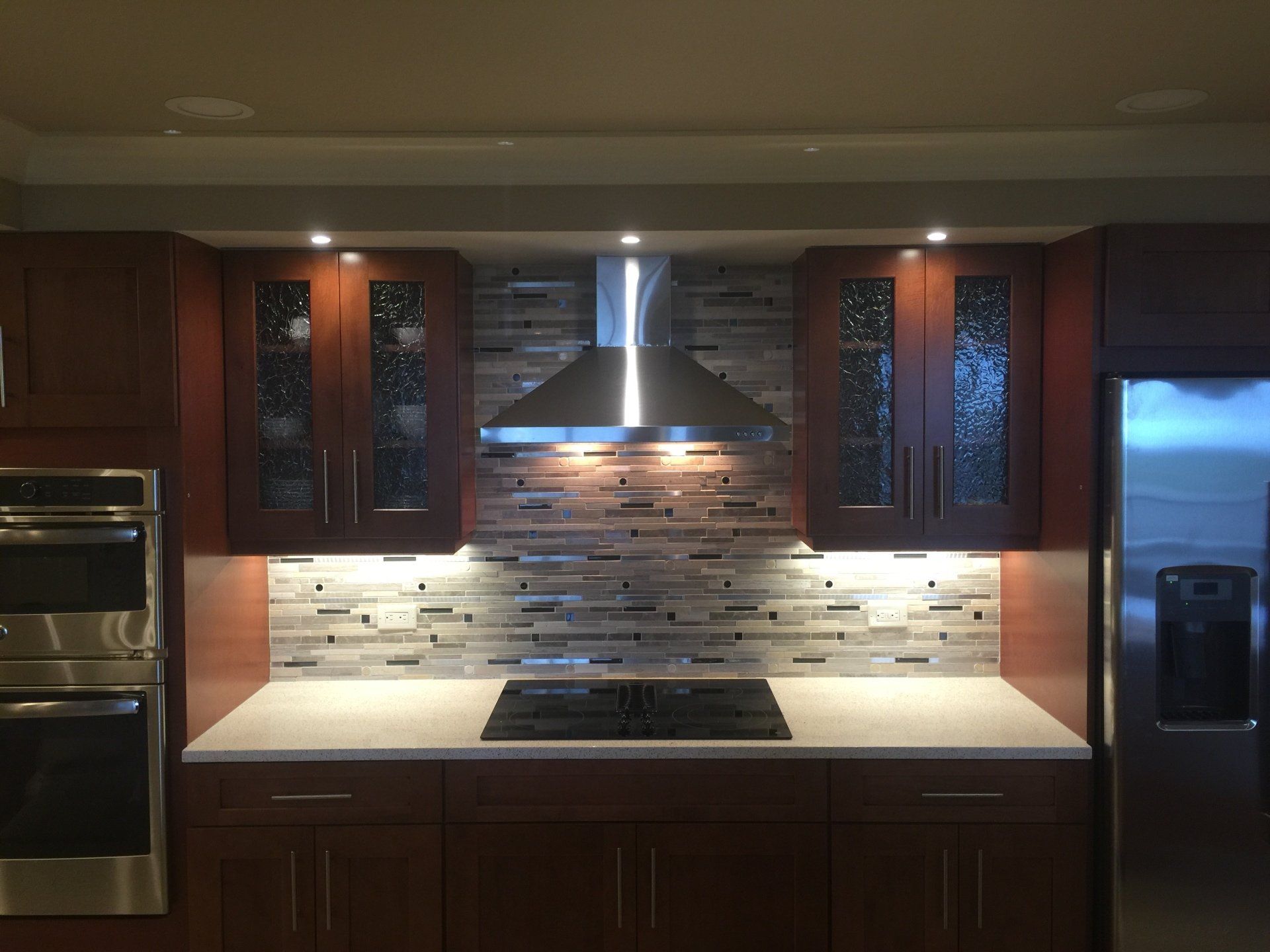 luxury kitchen remodel renovation with backsplash and dark cabinets