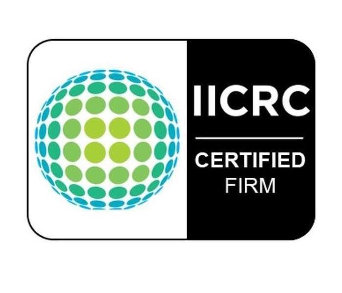 An iicrc certified firm logo with a green and blue globe