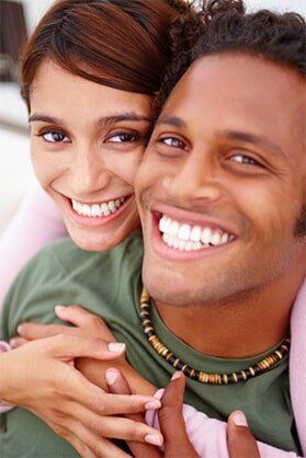 Smiling couple having fun — General Dentistry in Tallahassee, FL Smiling couple having fun — General Dentistry in Tallahassee, FL