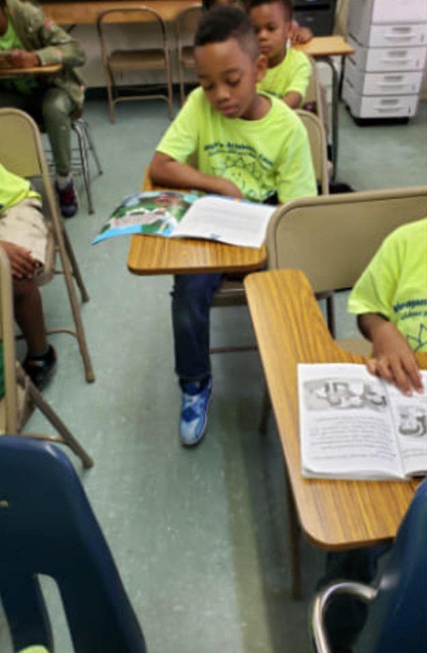 Little Boy Reading — Miami, FL — Meagan’s Academic Tutorial Center