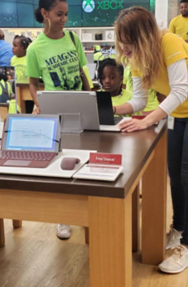 Teacher Helping Students — Miami, FL — Meagan’s Academic Tutorial Center