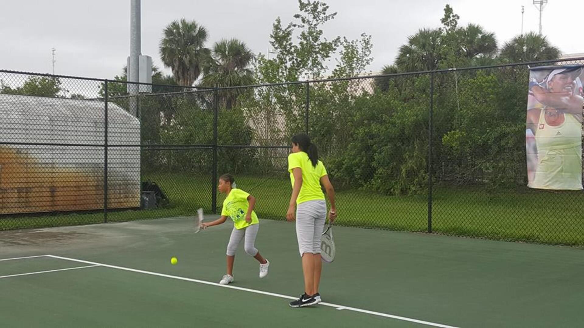 Students Playing Tennis — Miami, FL — Meagan’s Academic Tutorial Center