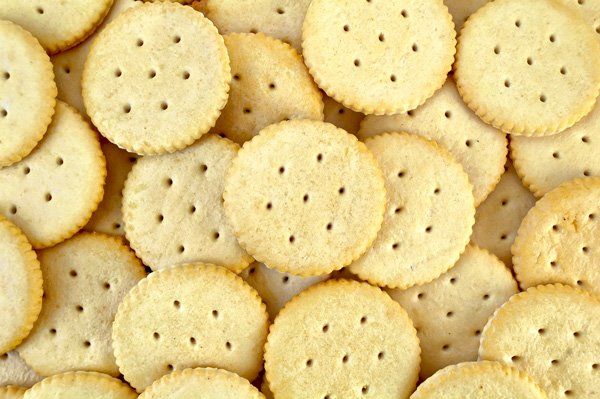 A pile of crackers with holes in them