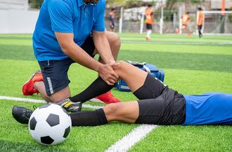 Footballer Wearing A Blue Shirt Got Injured — Moulton, AL — Plaxco Chiropractic Clinic Footballer Wearing A Blue Shirt Got Injured — Moulton, AL — Plaxco Chiropractic Clinic