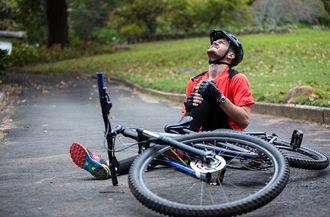 Male Cyclist Getting Injured — Moulton, AL — Plaxco Chiropractic Clinic Male Cyclist Getting Injured — Moulton, AL — Plaxco Chiropractic Clinic
