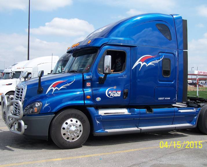 Blue vehicle with sign on side - custom wood, aluminum & lighted signs in Council Bluffs, IA