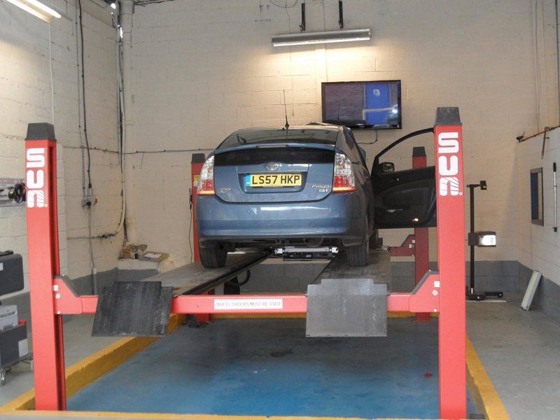 Car on equipment inside Tomlinson Autos Ltd Garage