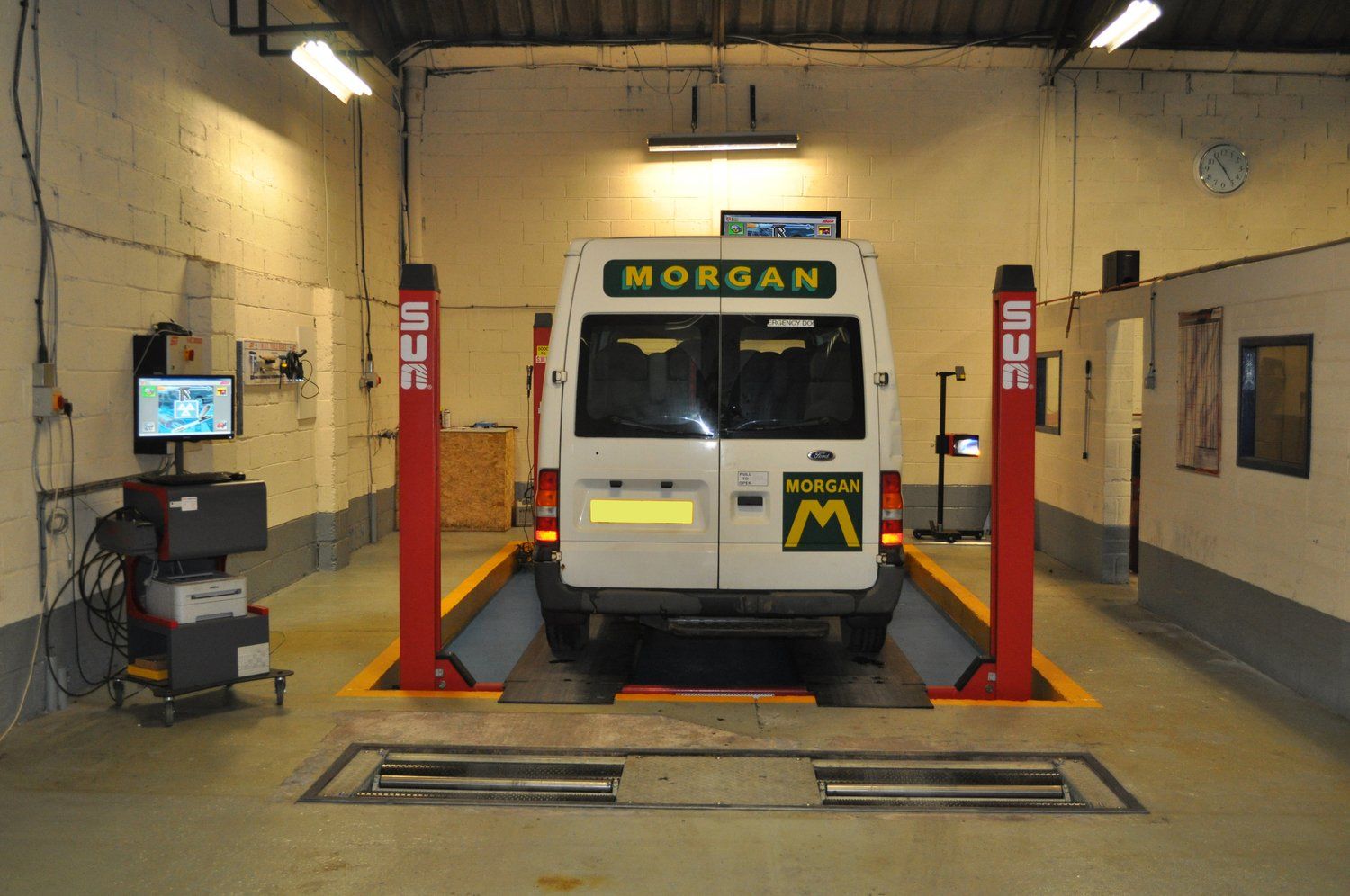 Van parked inside Tomlinson Autos Ltd Garage