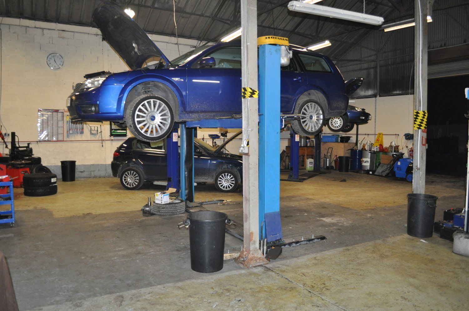 Car raised on machinery ready for MOT