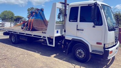 Excavator Bucket Loaded in Tow Truck — Towing and Transport in Sunshine Coast, QLD Excavator Bucket Loaded in Tow Truck — Towing and Transport in Sunshine Coast, QLD