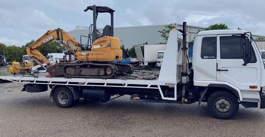Excavator Loaded in Tow Truck — Towing and Transport in Sunshine Coast, QLD Excavator Loaded in Tow Truck — Towing and Transport in Sunshine Coast, QLD