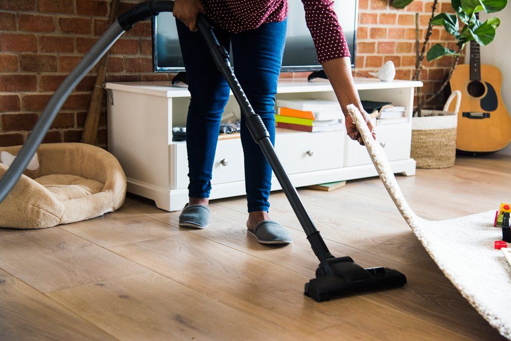 Person providing house cleaning service in North Scottsdale, AZ A house cleaner providing residential cleaning service in North Scottsdale, AZ