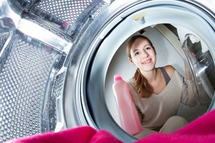 Young woman doing laundry - Washing & Folding Services in Rockland, Maine Young woman doing laundry - Washing & Folding Services in Rockland, Maine