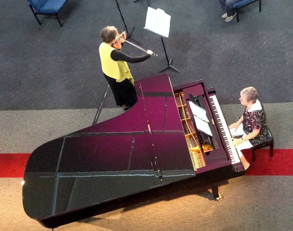 woman playing a piano
