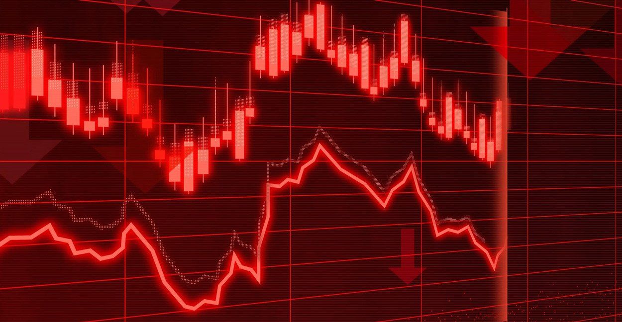 Red stock market charts, showing downward trends and financial loss.