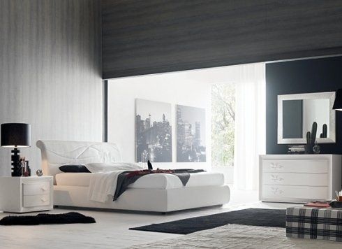 camera da letto con comò e specchiera