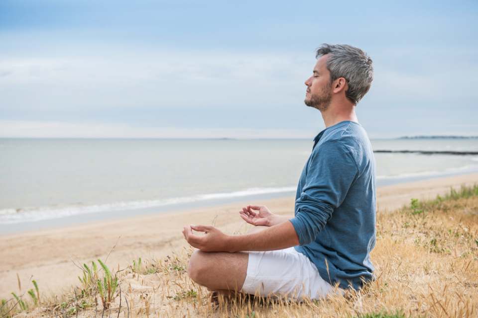 man mediating