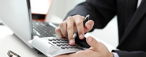 Mortgage expert doing the calculations in Boston