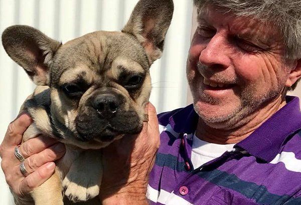 man holding dog